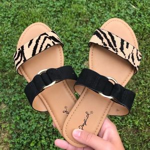 Black and tiger sandals